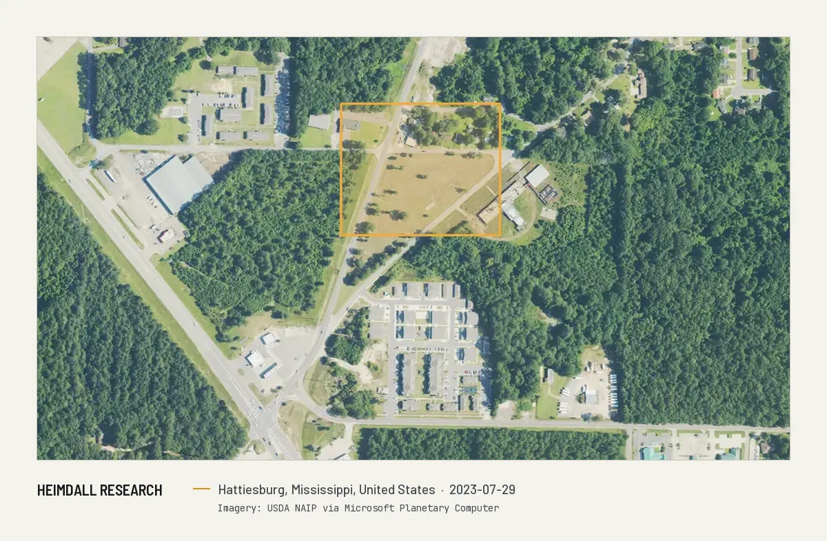 Print preview: The same area in July 2023. An apartment complex now stands where the drive-in was, and the outlined register location is still an empty field and woods.