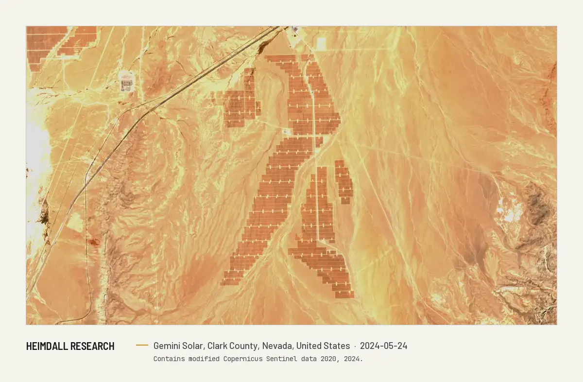 Print preview: The same frame in May 2024, with the dark rectangular blocks of the completed solar plant covering the center of the image.
